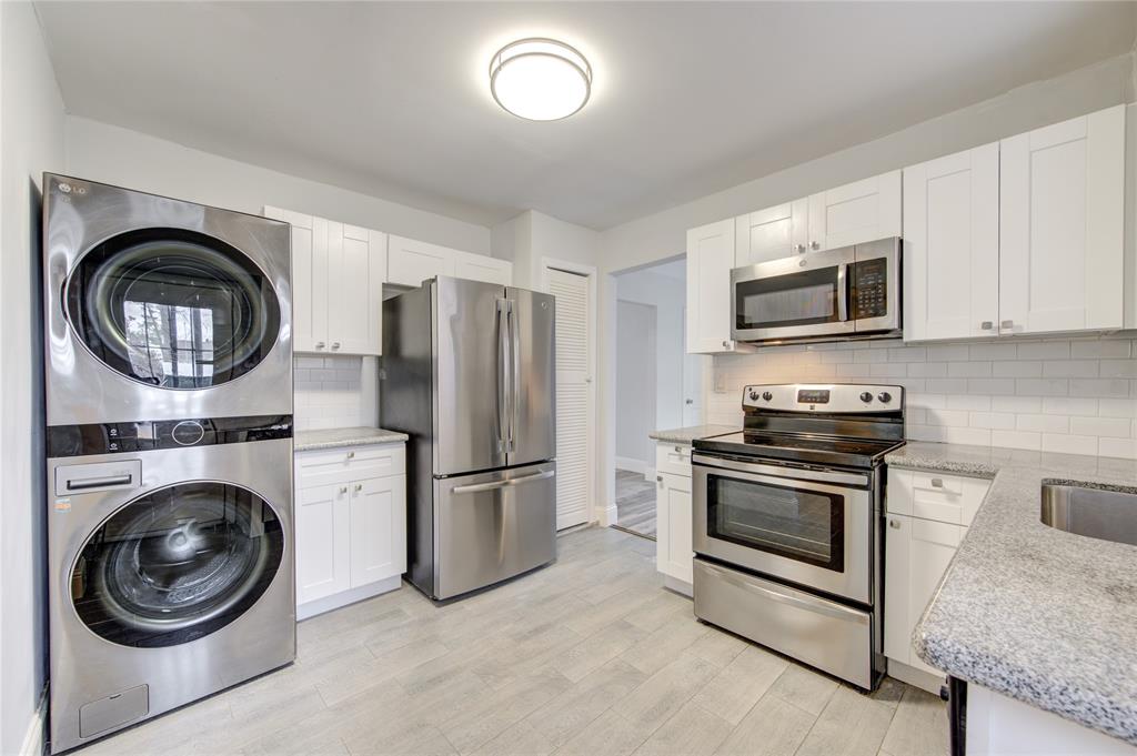 a kitchen with a stove and a microwave