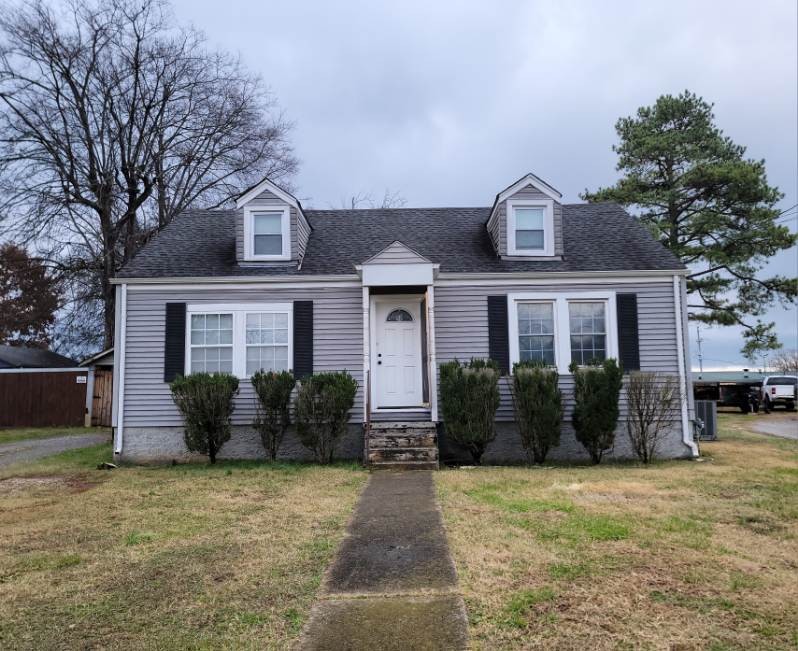 a front view of a house with yard