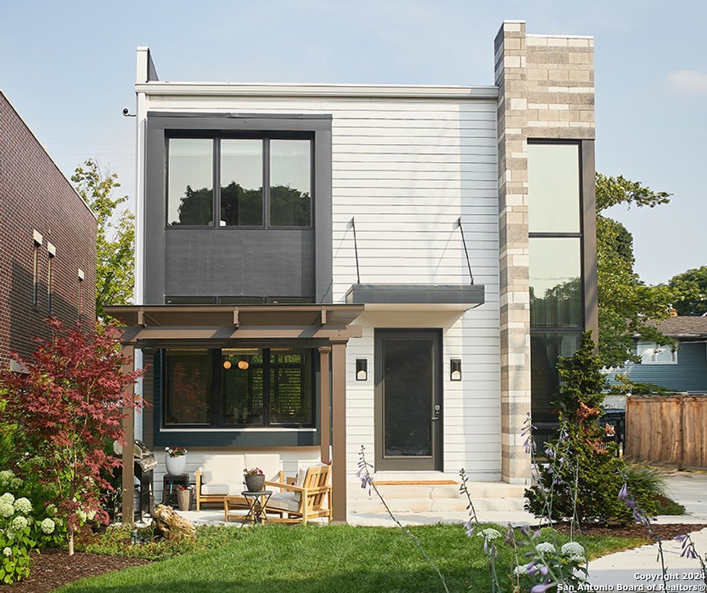 a front view of a house with garden