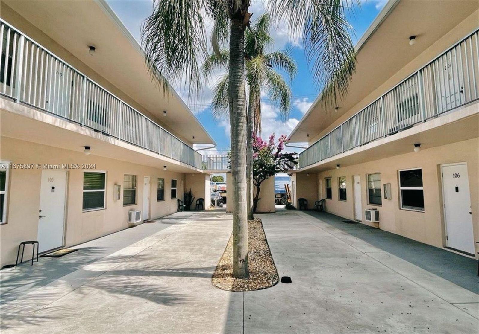 a view of a building with a yard