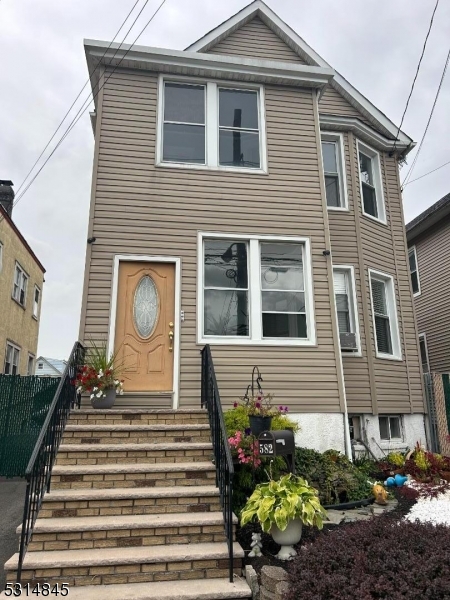 a view of a house with a bench