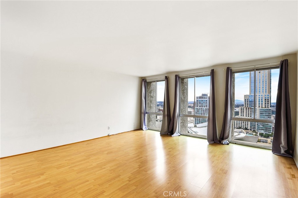 a view of an empty room with glass door