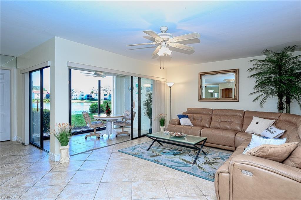 Living room area and lanai with expansive lake view.