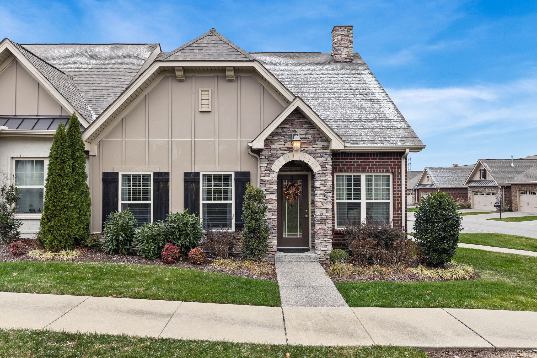 a front view of a house with garden