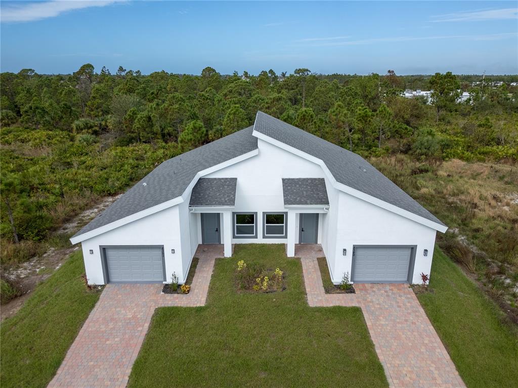 a view of a house with a yard