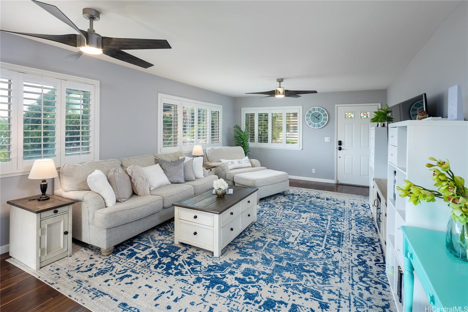 a living room with furniture and a rug