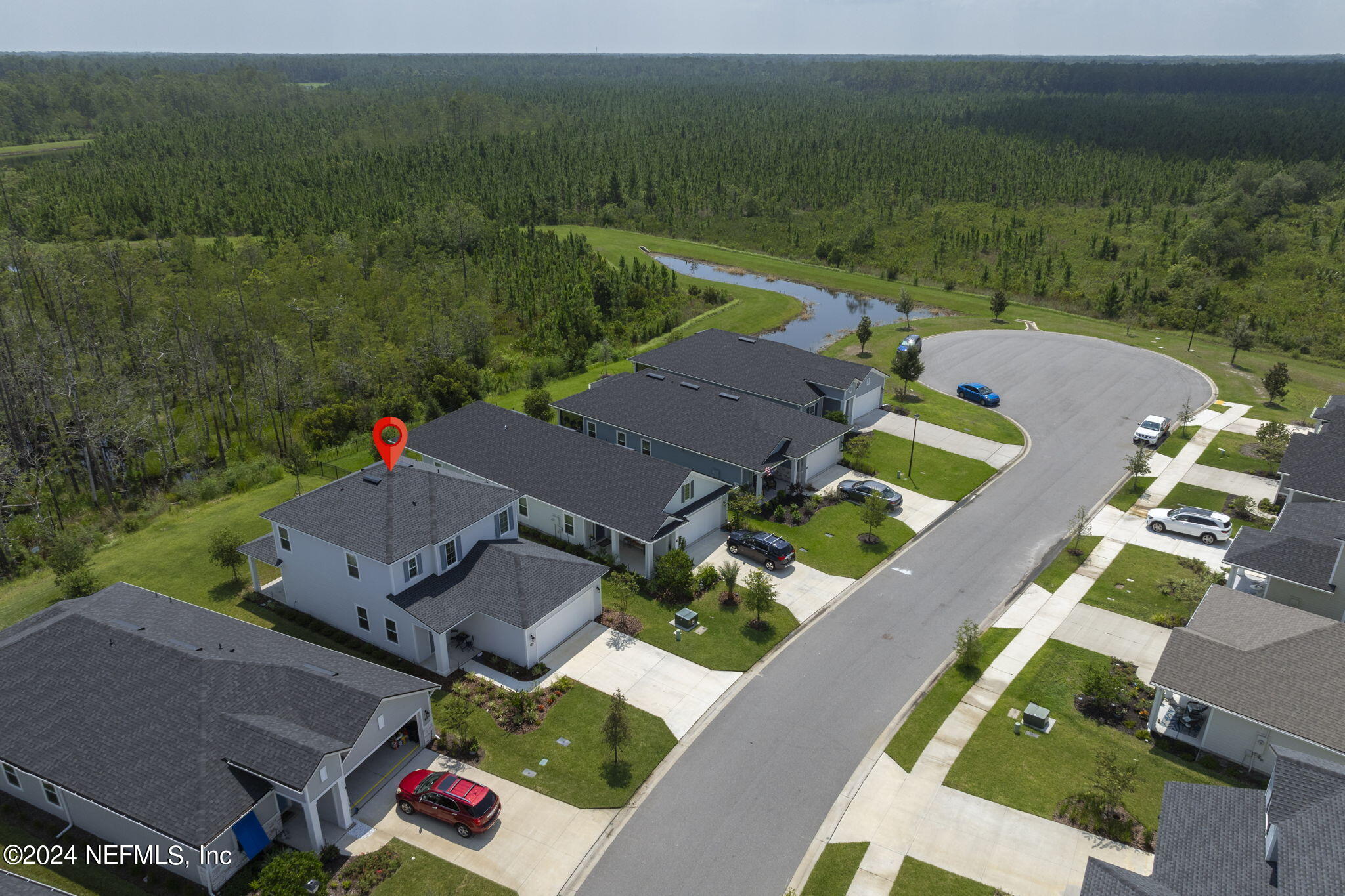 an aerial view of a house with a garden