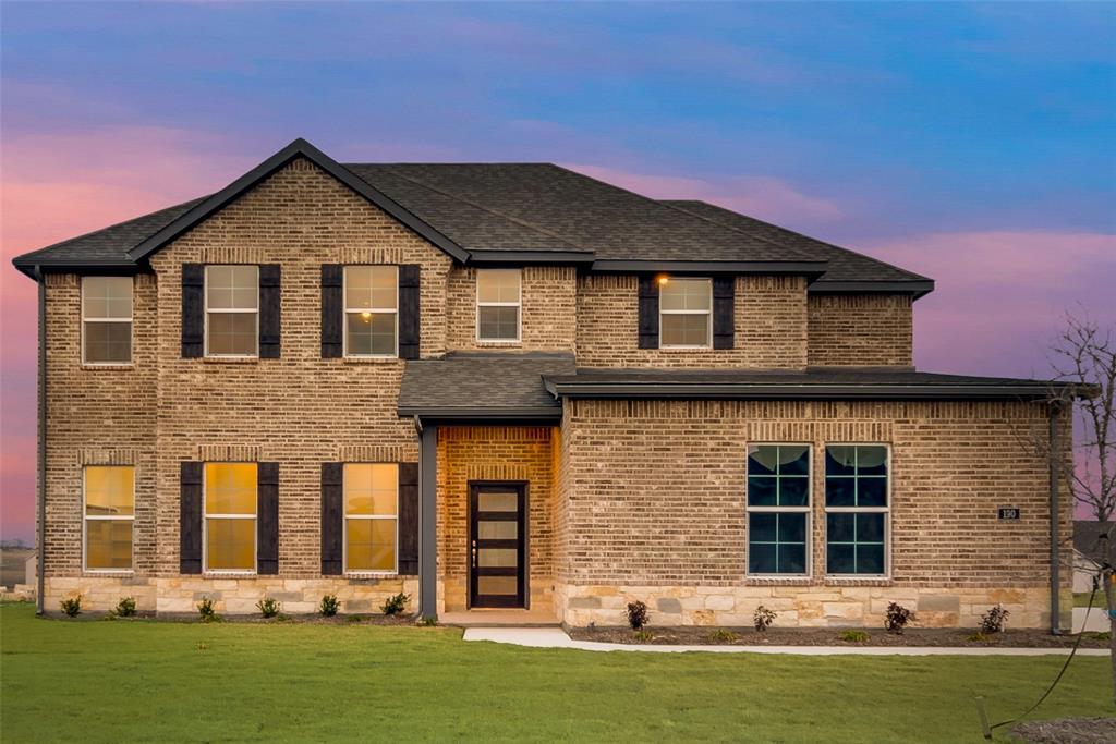 front view of a house with a yard