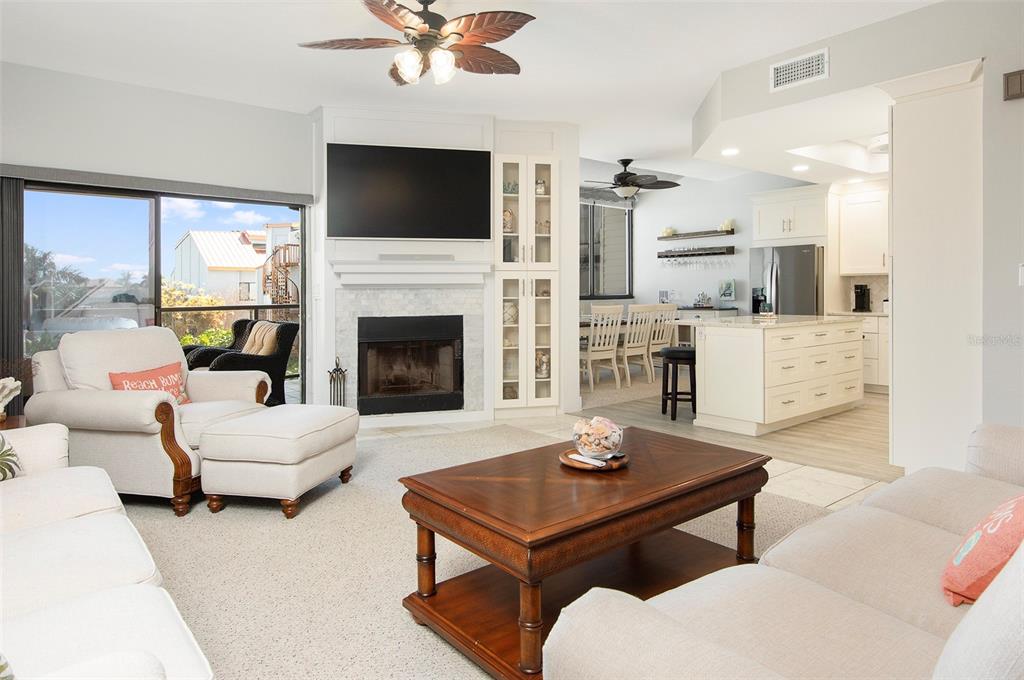 a living room with furniture fireplace and a flat screen tv