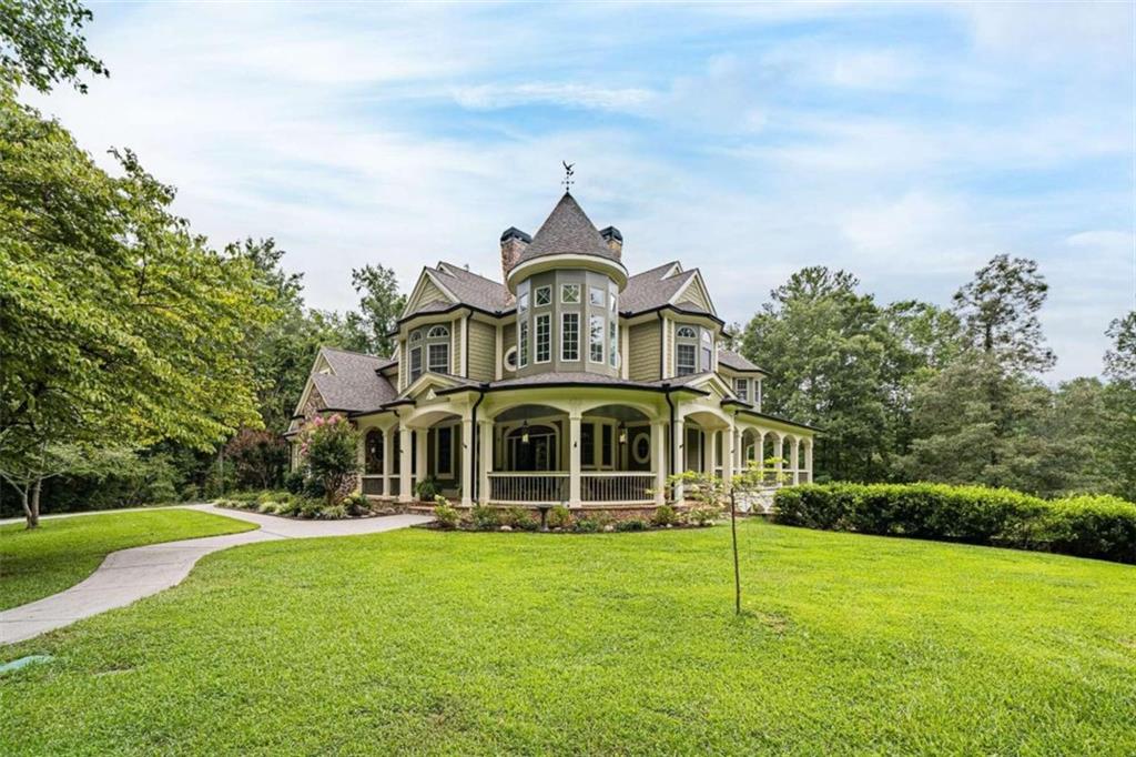 a front view of a house with a garden