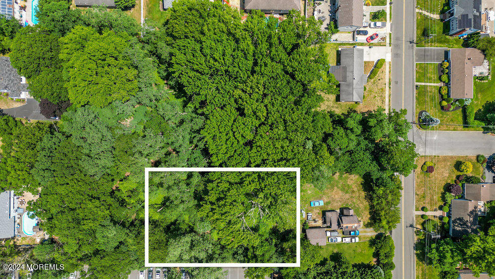 an aerial view of a house with yard