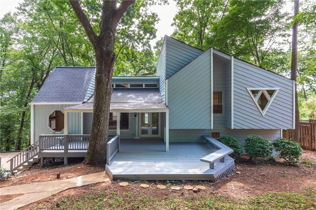 a aerial view of a house with a yard garage and outdoor seating