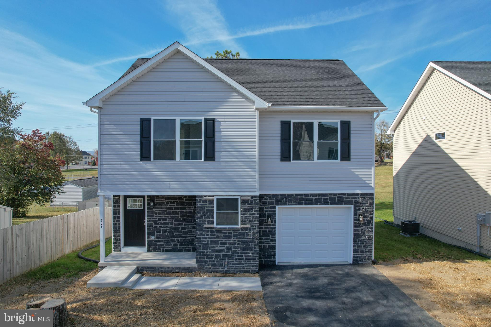 a front view of a house with garage