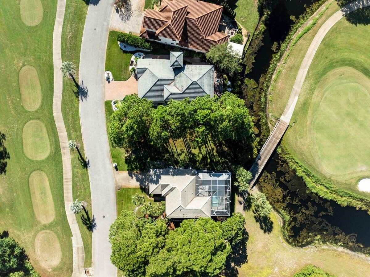 an aerial view of a house with swimming pool