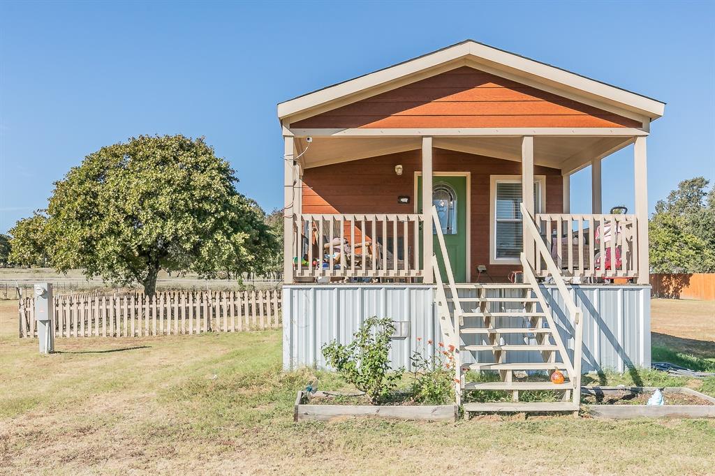 a front view of a house with a porch