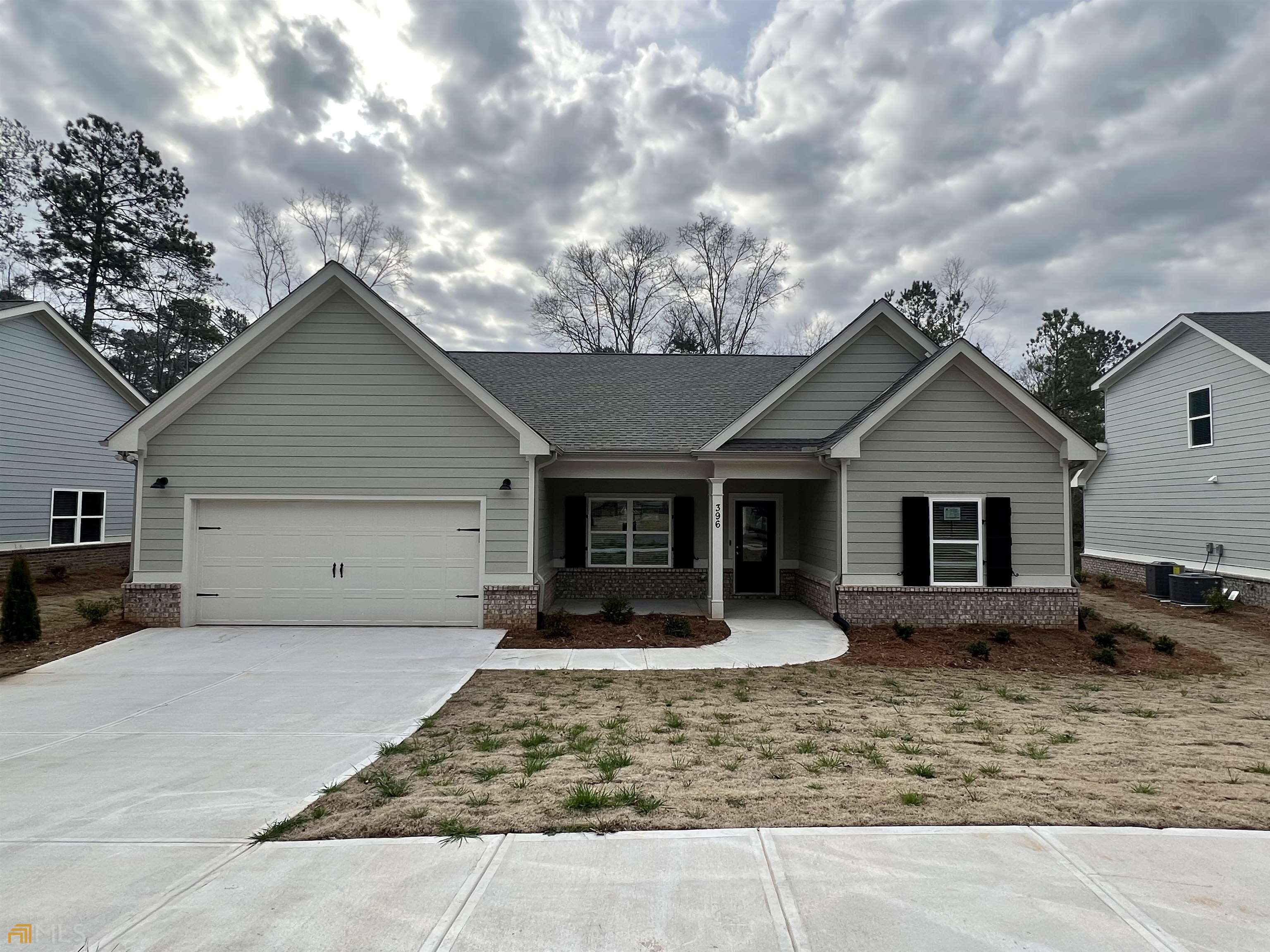 a front view of house with yard outdoor seating and barbeque oven