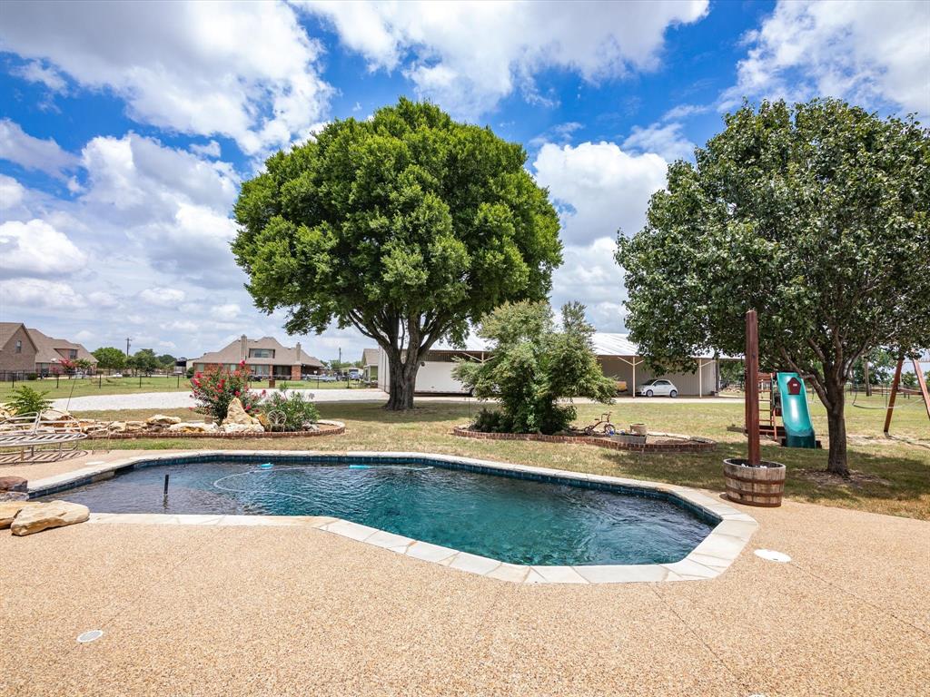 a view of outdoor space yard and swimming pool