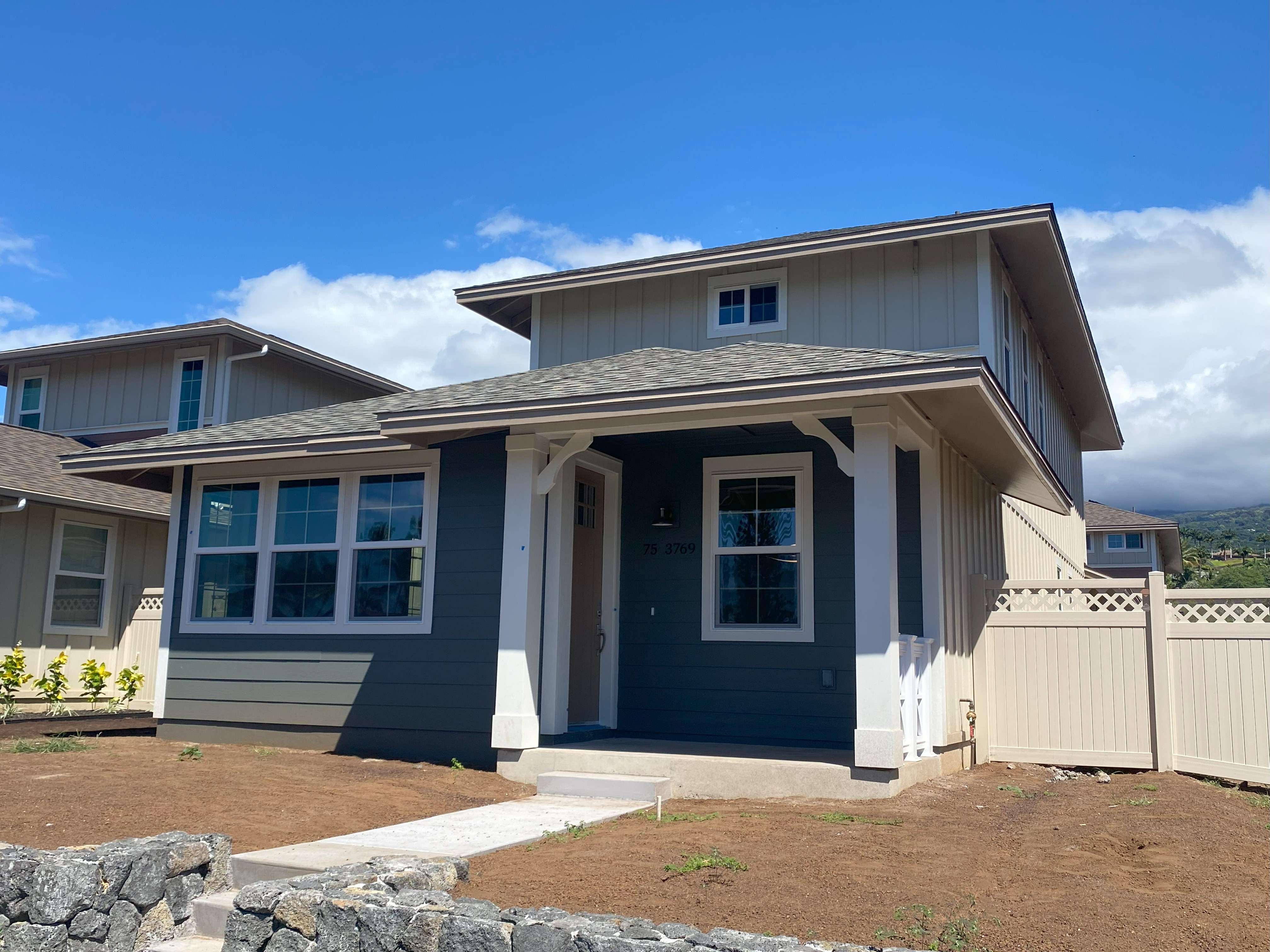 a front view of a house with a garage