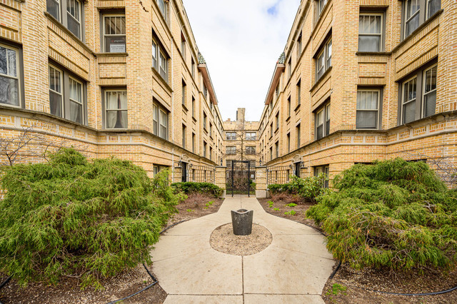 a view of a multi story residential apartment building