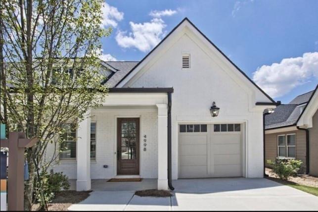 a front view of a house with a garage