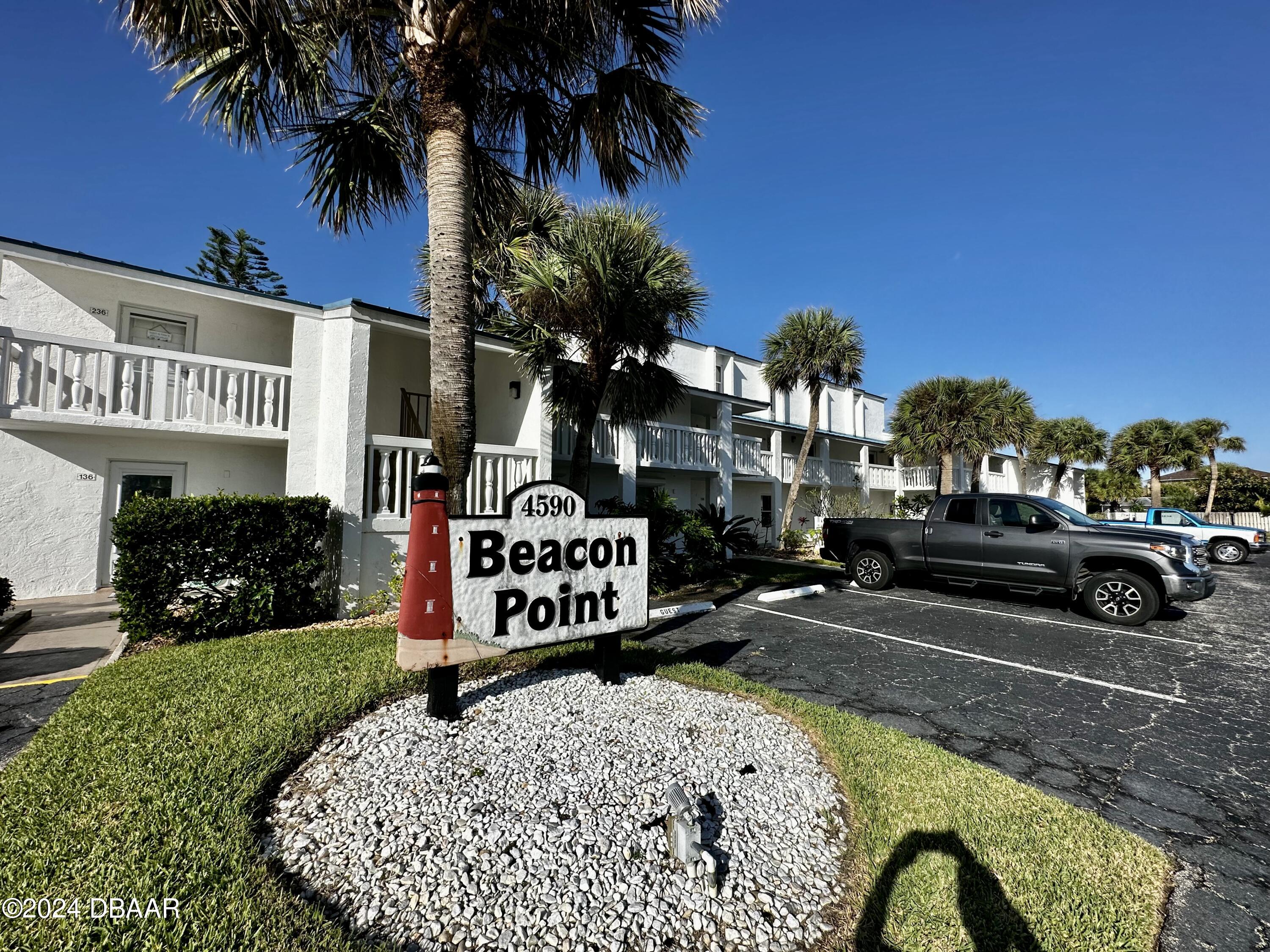 a view of a park that has a sign board