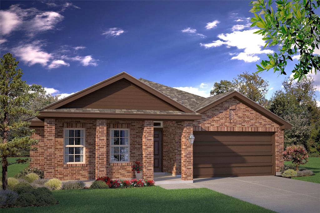 a front view of a house with a garden and yard