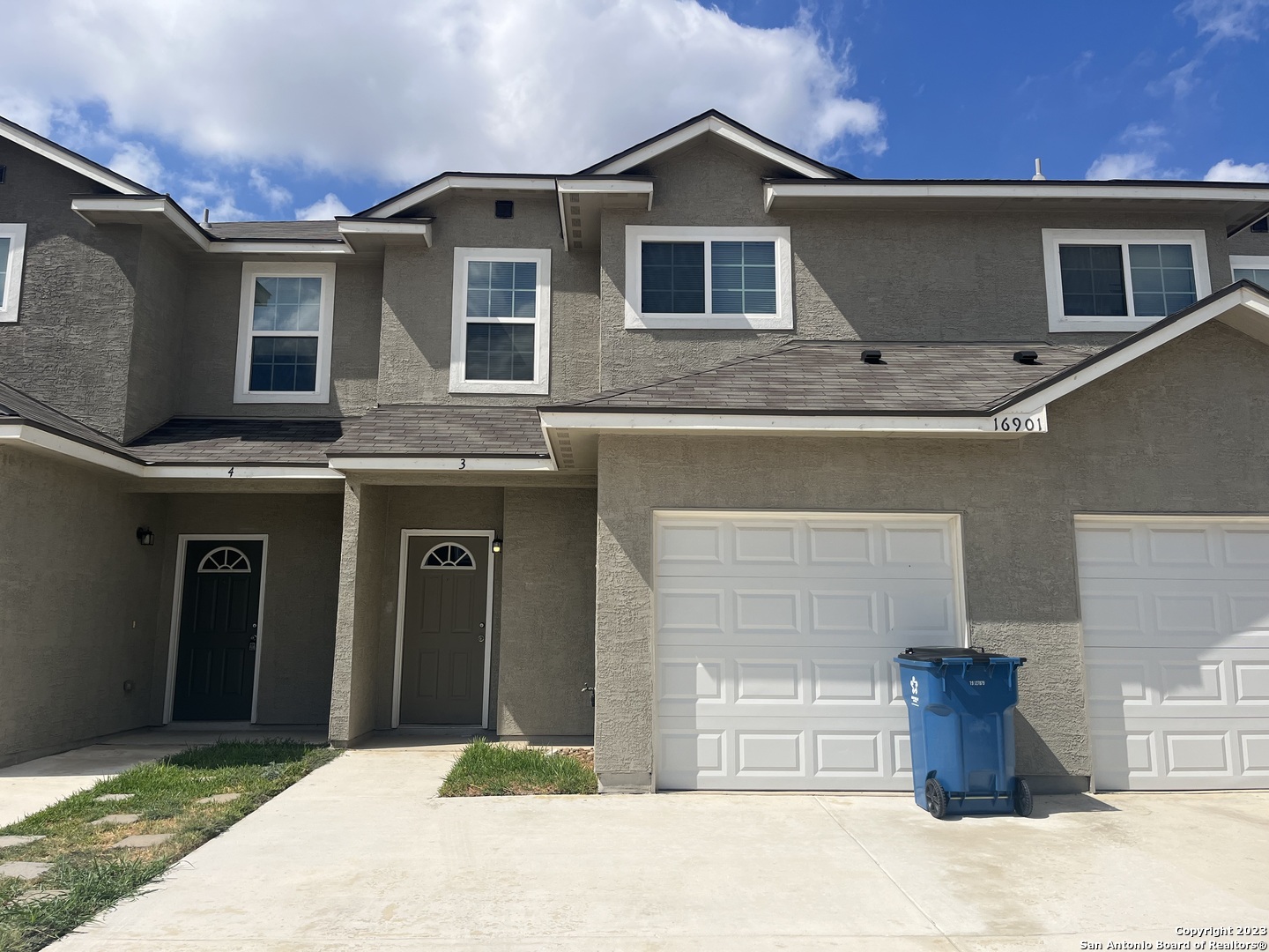 a front view of a house with parking