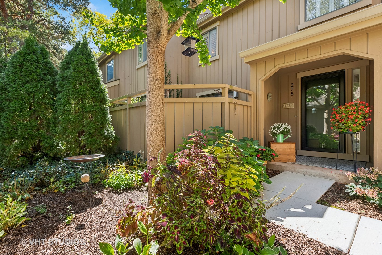 a front view of a house with garden