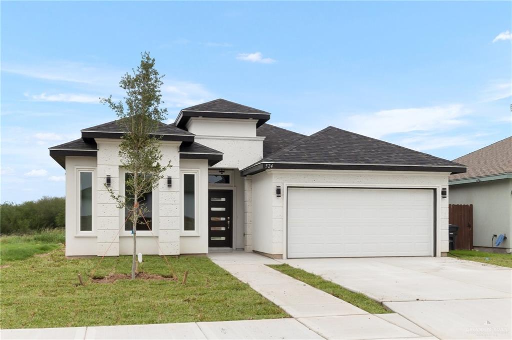 a front view of a house with a garage