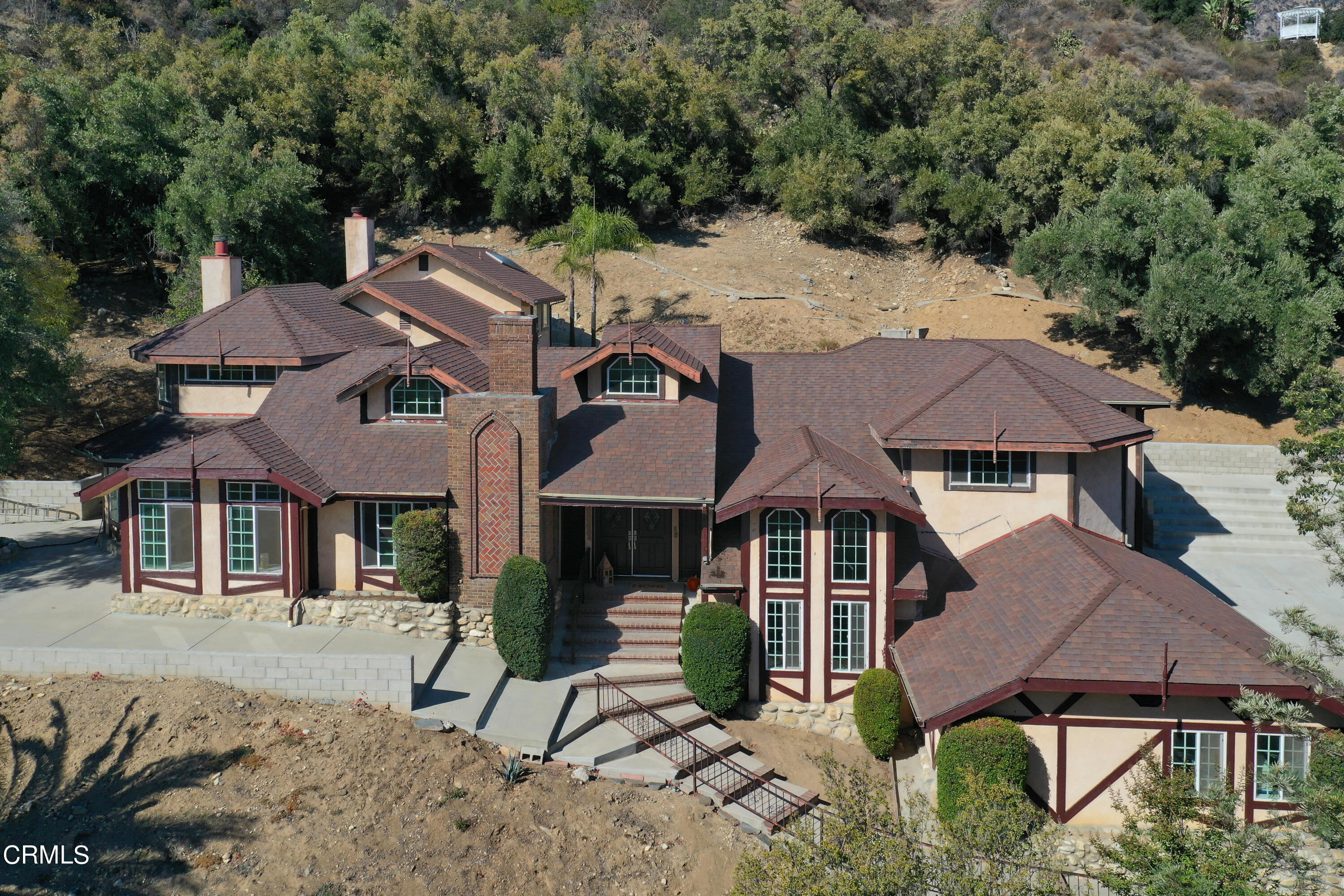 a aerial view of a house with a yard