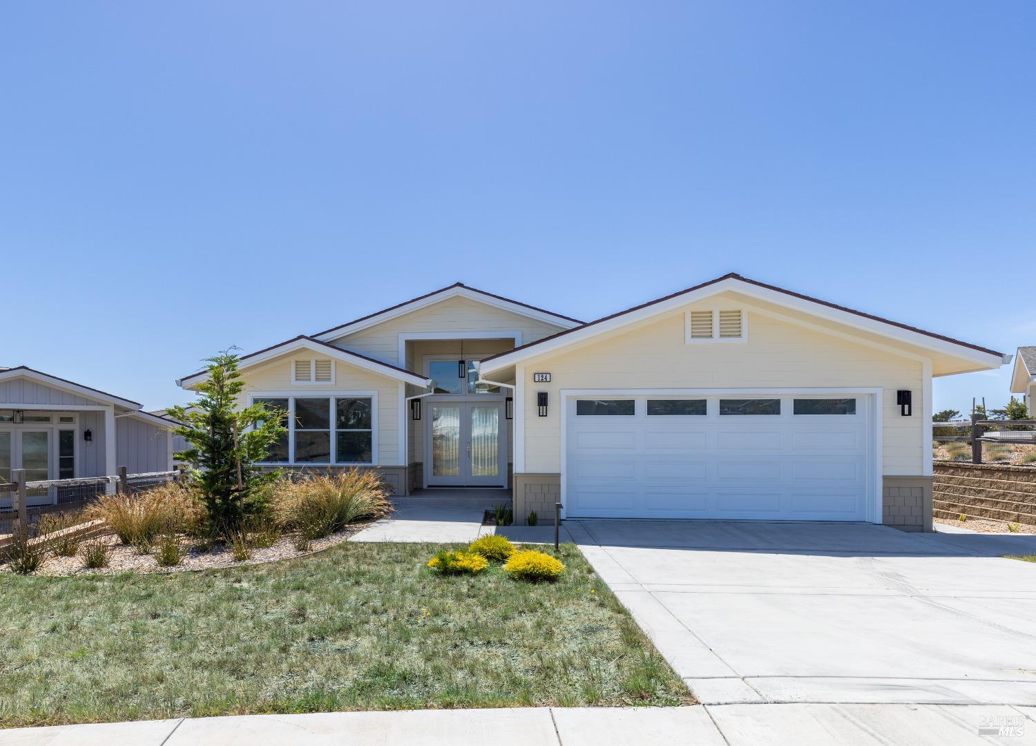 front view of a house with a yard