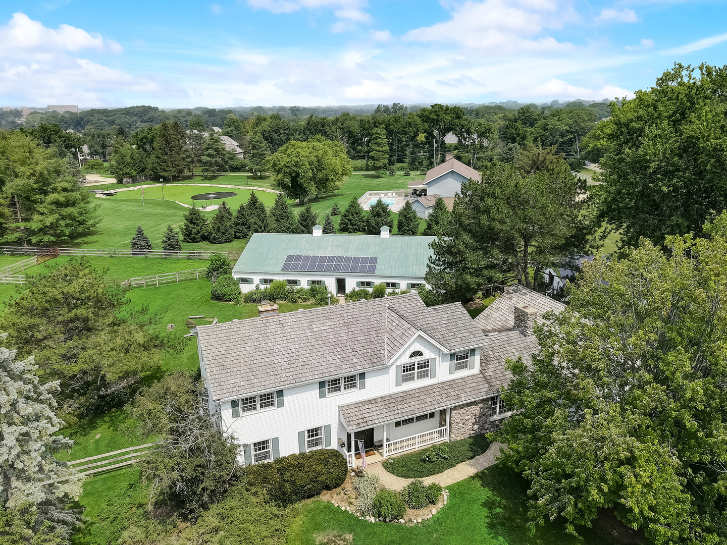 an aerial view of a house with yard