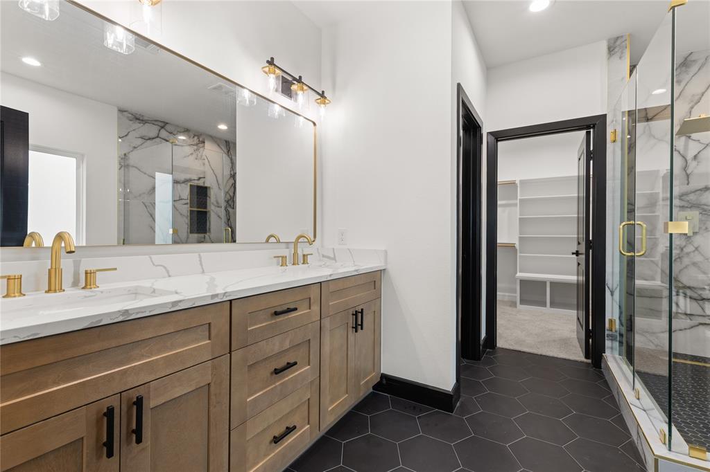 a bathroom with a double vanity sink and mirror