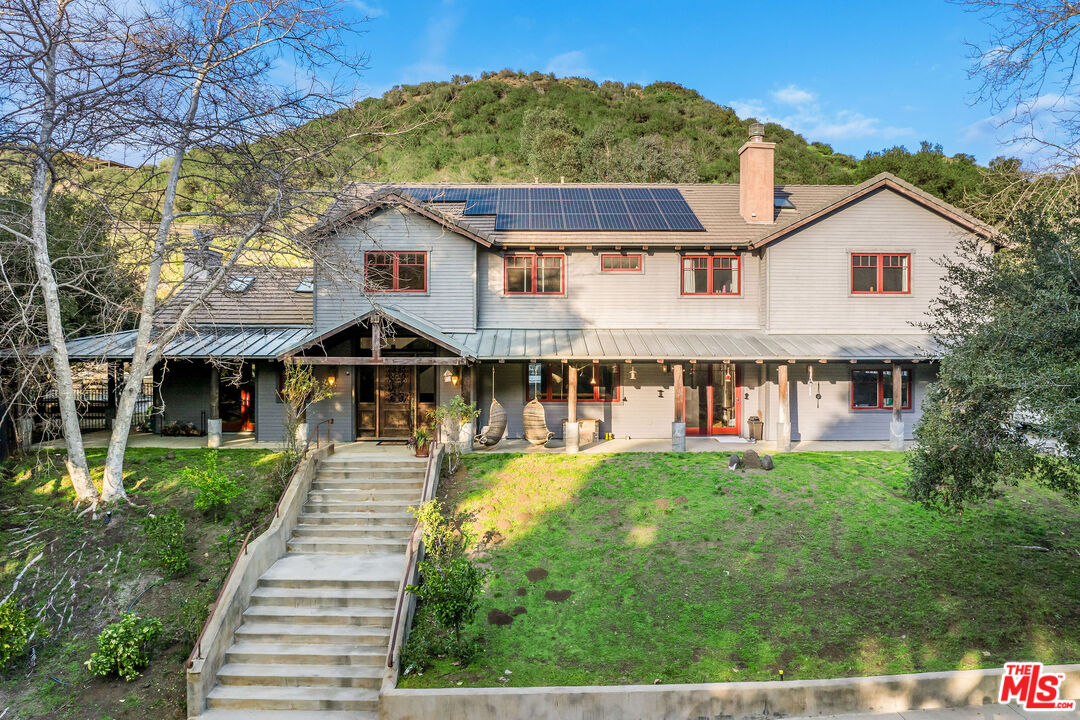 a aerial view of a house with a yard