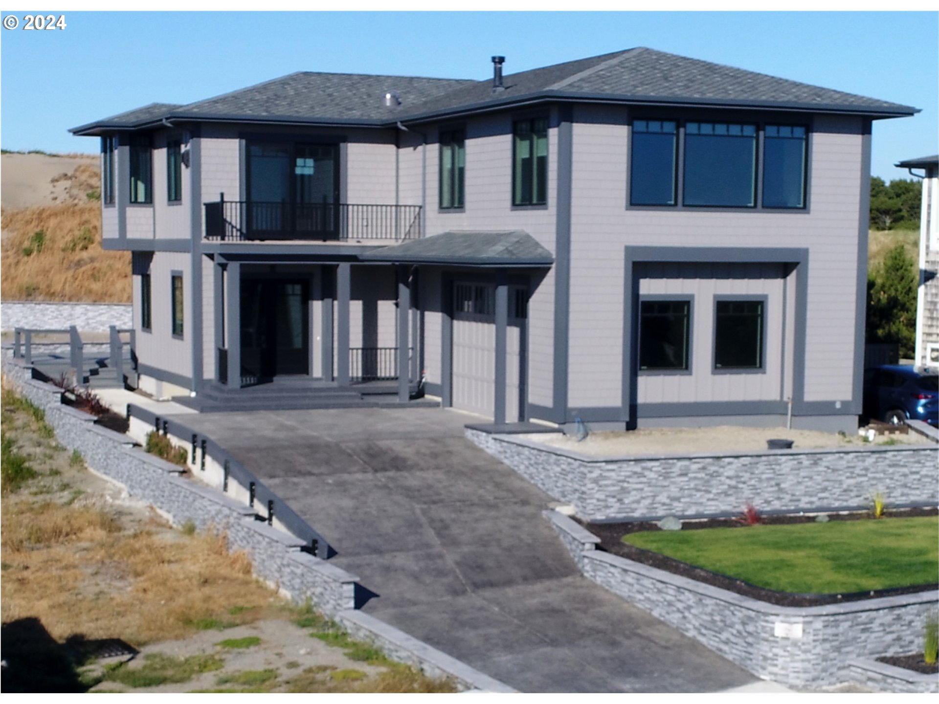 a front view of a house with garden