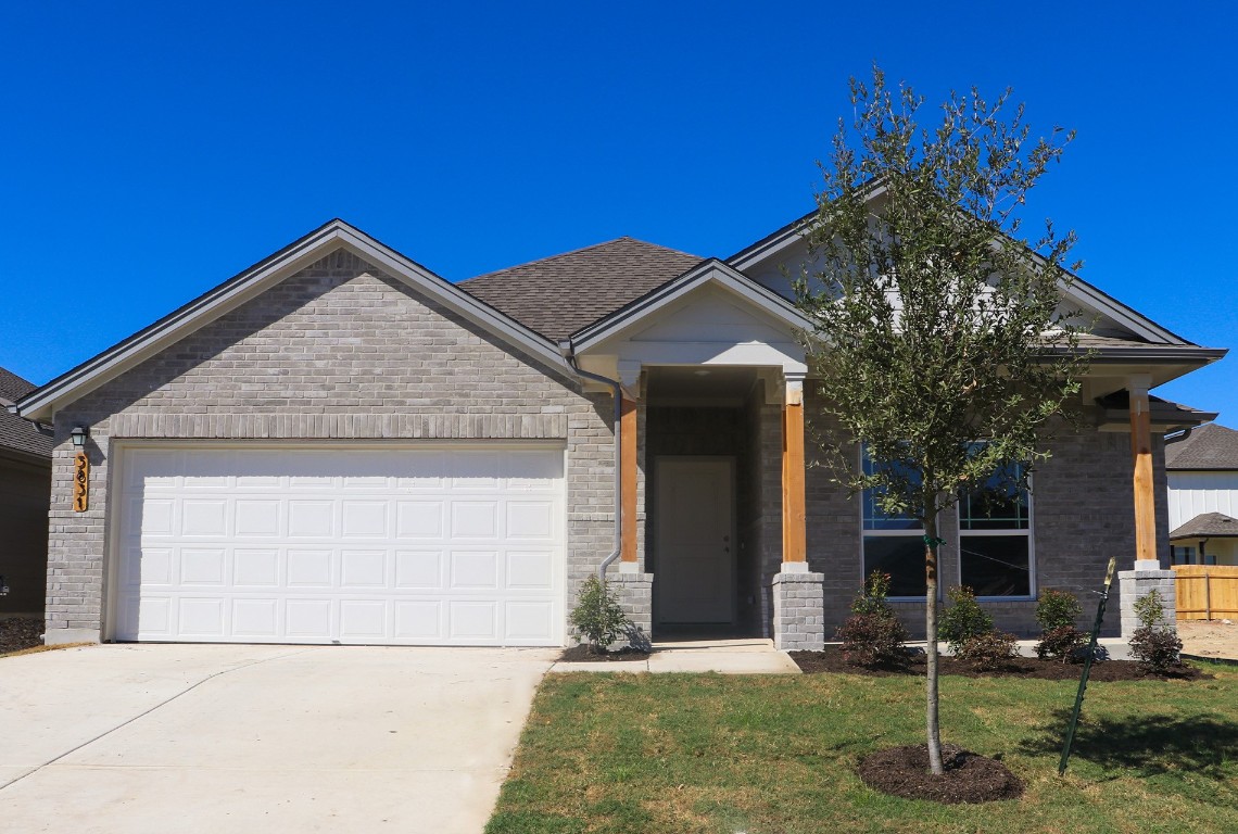 a view of house with backyard