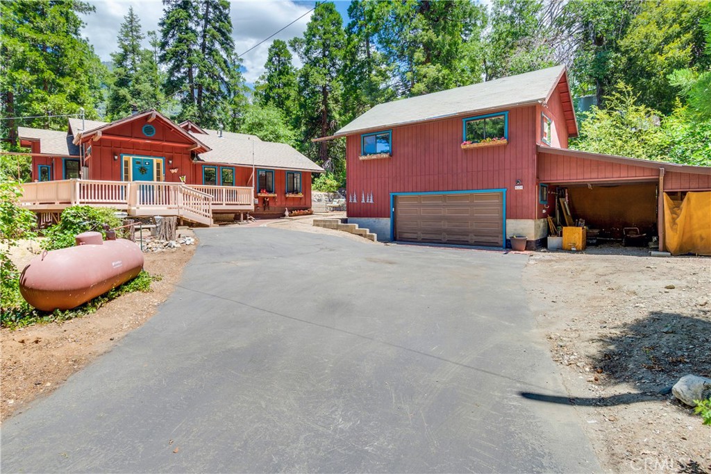 a front view of a house with yard and seating area