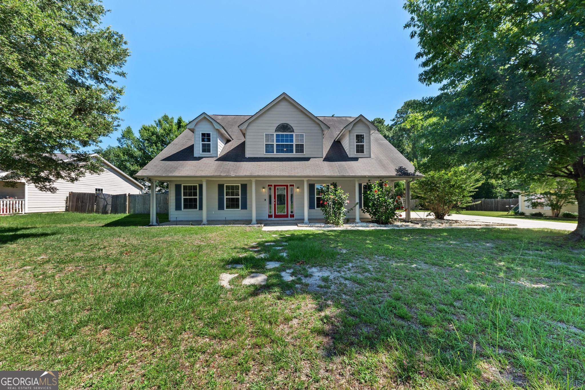 a front view of a house with a yard