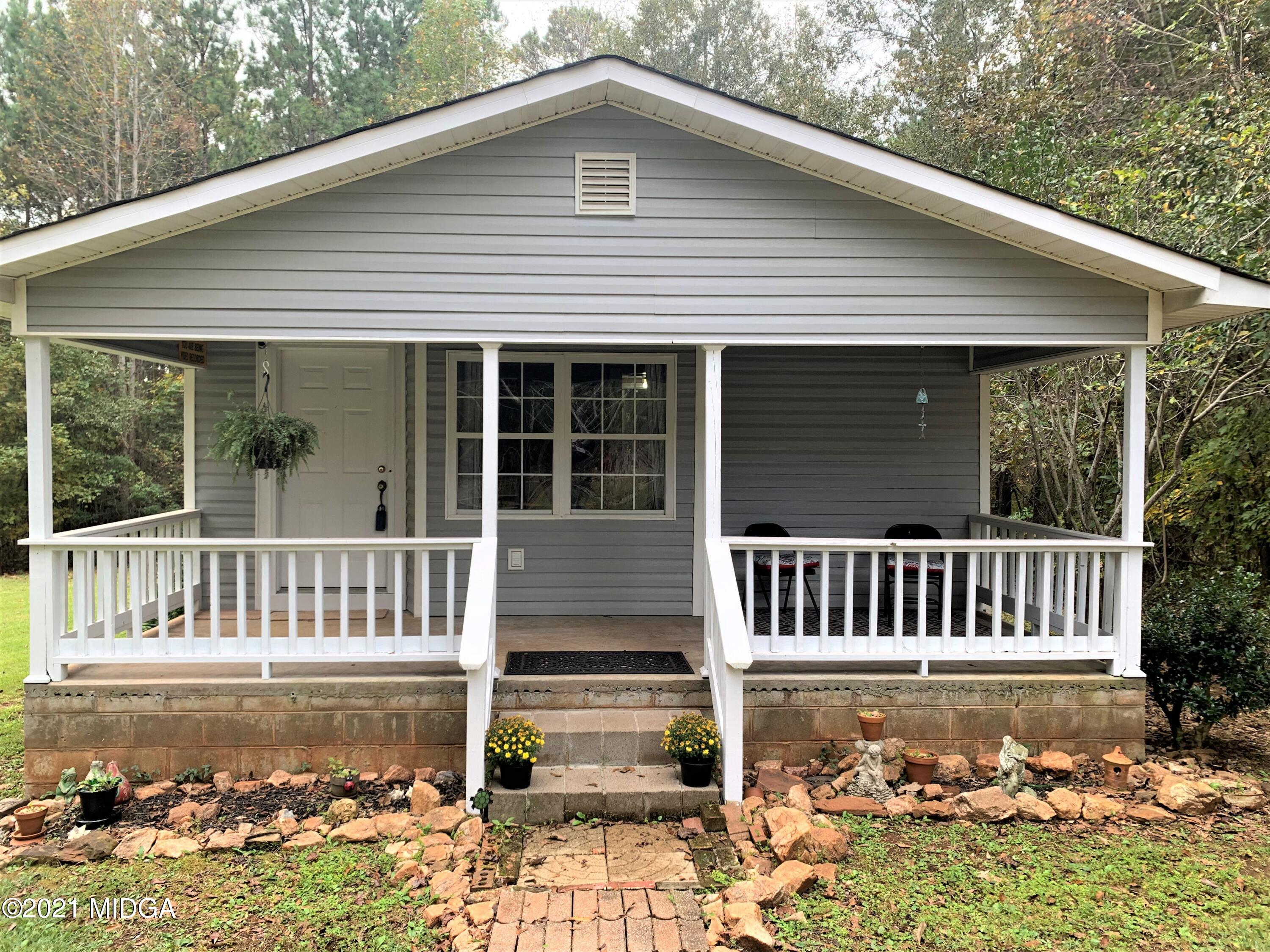 a view of a house with wooden deck