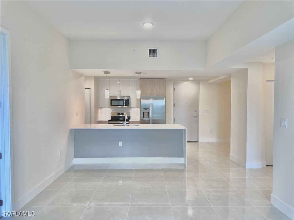 a view of kitchen and front door