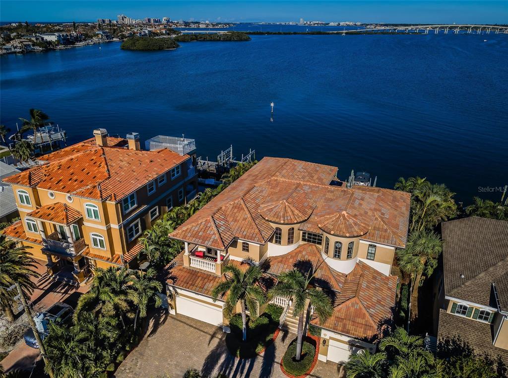 an aerial view of a house with a lake view