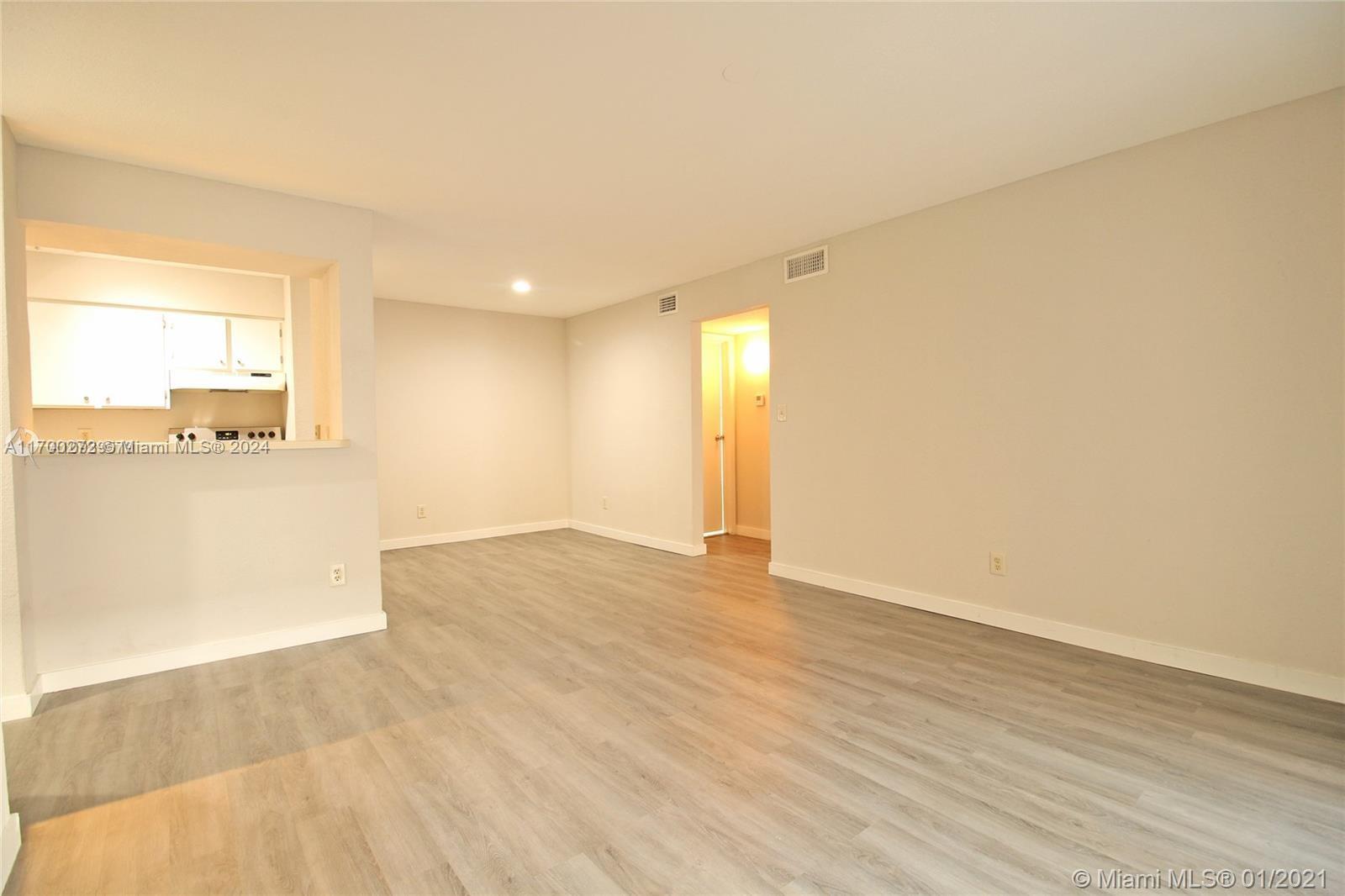 a view of an empty room and window