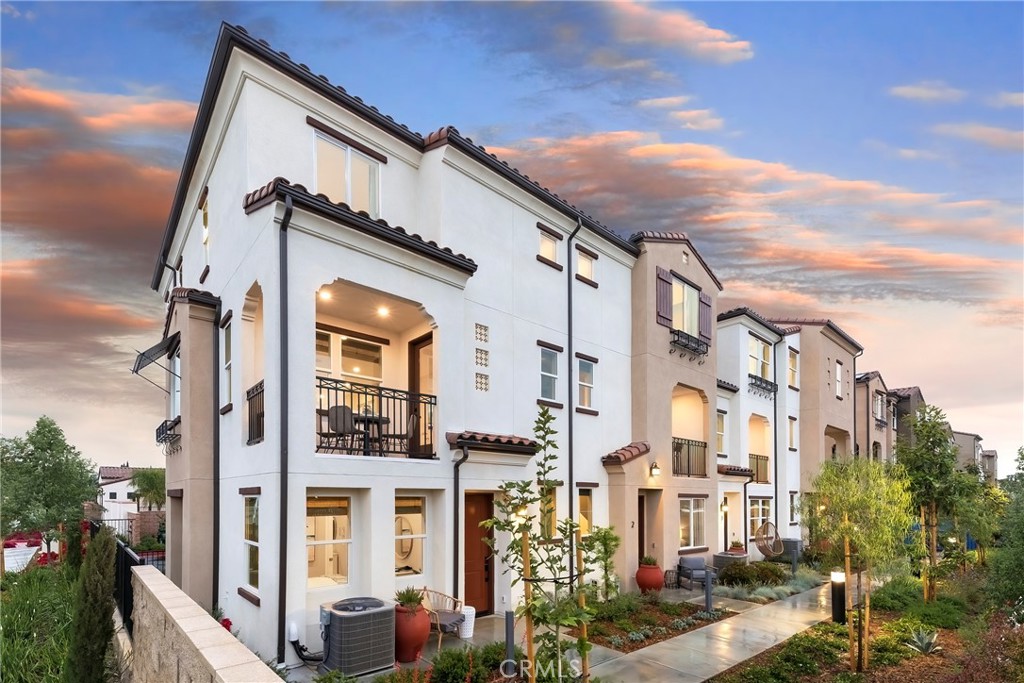 a front view of a residential apartment building with a street