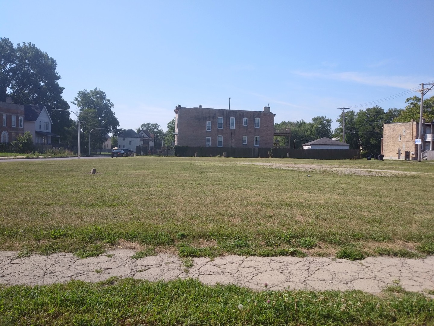 a view of a field with an ocean