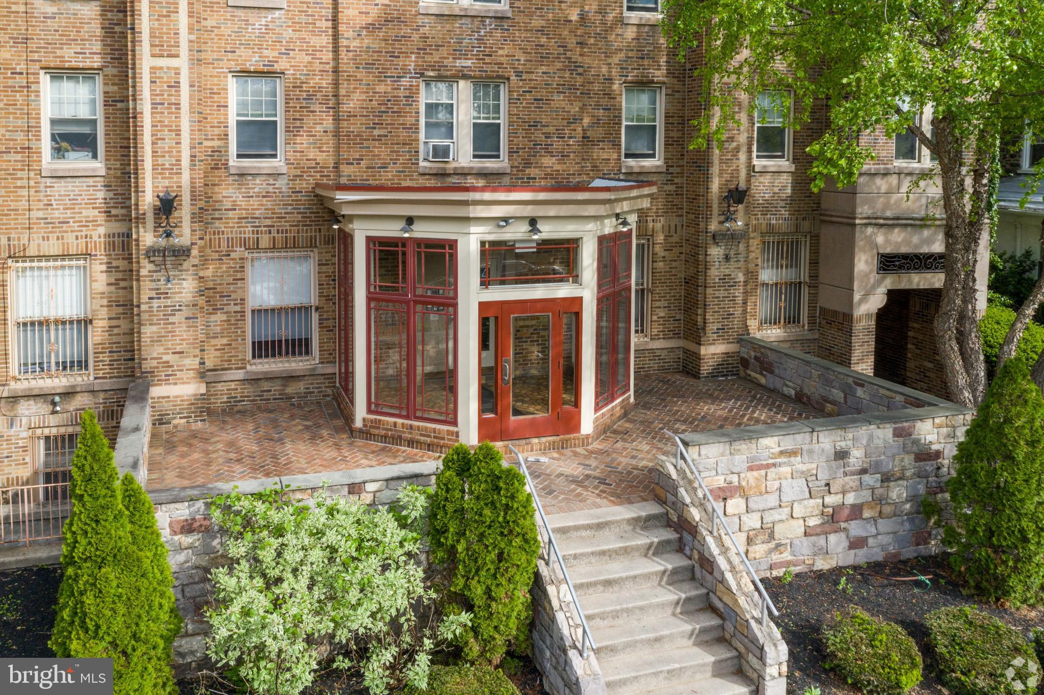 front view of a house with a large window