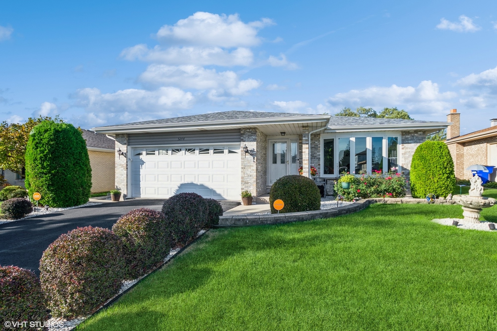 a front view of a house with garden