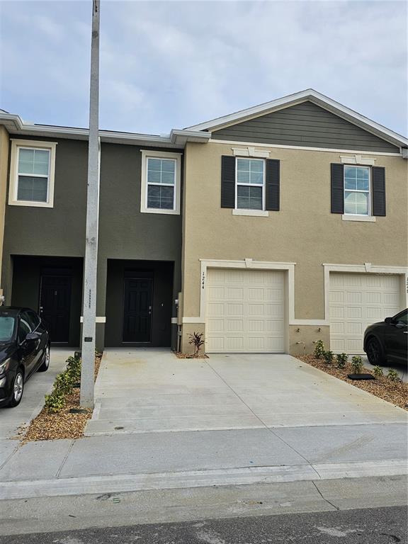 a front view of a house with yard