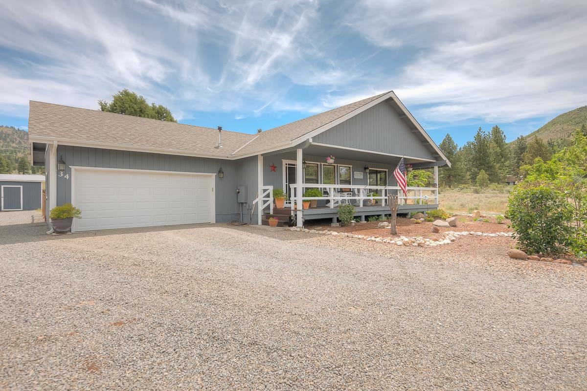 a view of a house with a yard and garage