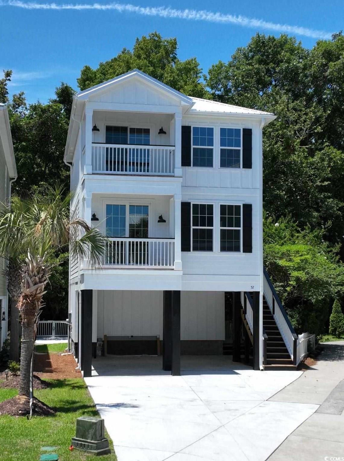 Coastal inspired home with a balcony