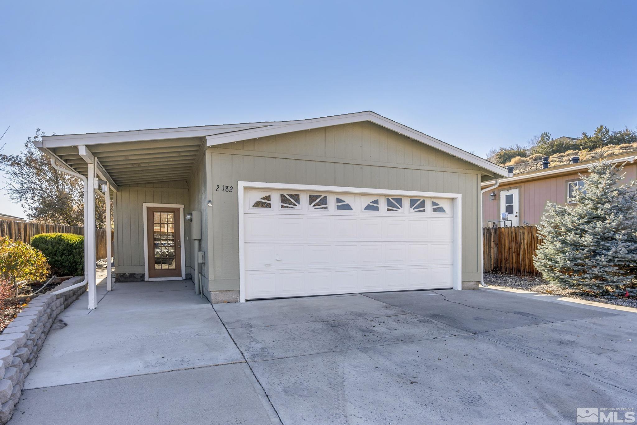 a view of a house with a garage